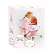 Caja cuco vintage La Nina mostrando cochecito clásico rosa con lazos blancos
