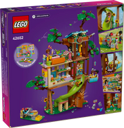 Caja del set LEGO Friends 42652 Casa del Árbol de la Amistad con vista de los espacios personalizables: zona de juegos, cocina, dormitorio y huerto con zanahorias. Set de 701 piezas con ventanas intercambiables, banco de trabajo con herramientas y accesorios variados. Juguete educativo para niños mayores de 8 años.

