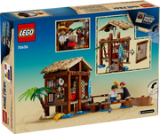 Caja trasera LEGO ONE PIECE Cabaña del Pueblo Molino 75636 mostrando detalles del interior, personajes Luffy, Shanks y Makino, y características del set de 299 piezas
