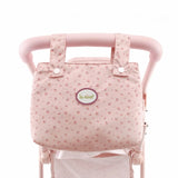 Detalle doble capazo gemelar Olivia con volantes y bolso rosa
