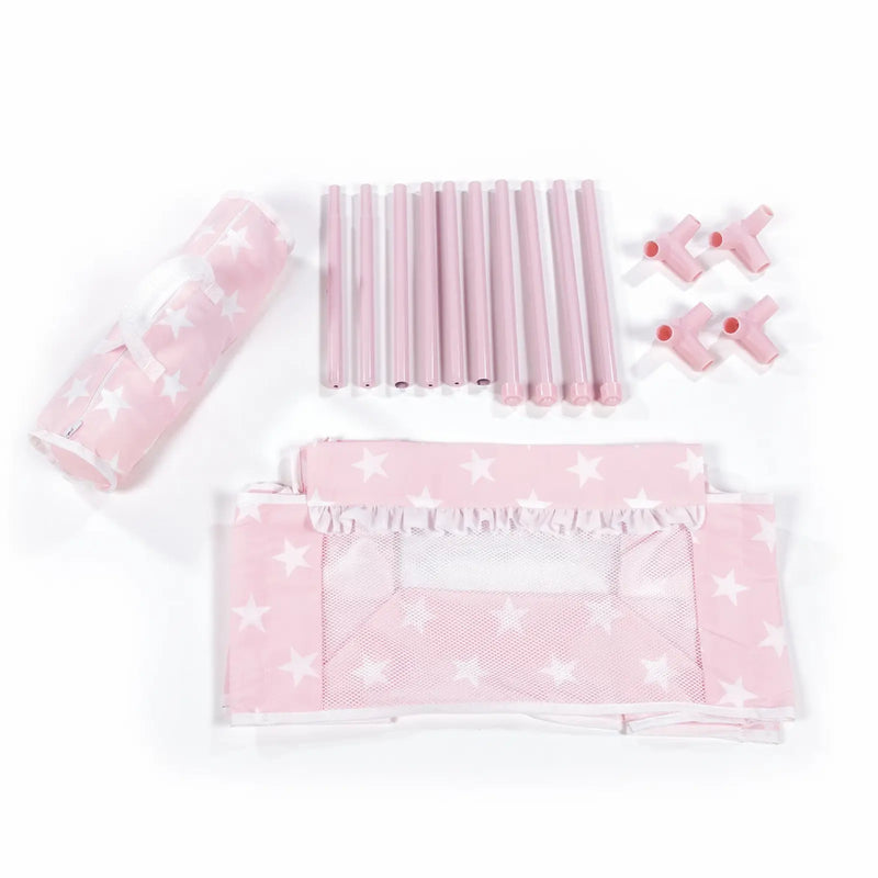 Detalle piezas desmontadas cuna Carlota: estructura rosa y textiles estrellas
