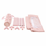Detalle piezas desmontadas cuna Olivia: tubos metálicos y textiles rosa
