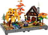 Diorama LEGO otoño con cabaña, sauce llorón, arce, estanque y girasoles