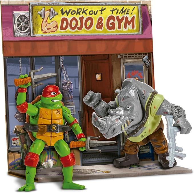Figuras de acción Tortugas Ninja Movie Face Off mostrando a Raphael y Rocksteady con detalles auténticos de batalla, equipamiento completo y poses dinámicas listas para el combate
