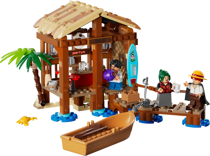LEGO ONE PIECE set 75636 con caja del producto y cabaña construida mostrando Luffy, Shanks, Makino en escena de playa con bote pirata y embarcadero detallado
