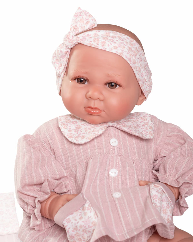 Muñeca Luca con bolsito y ropa floral
