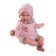 Muñeca realista 52 cm con ropa floral y gorro
