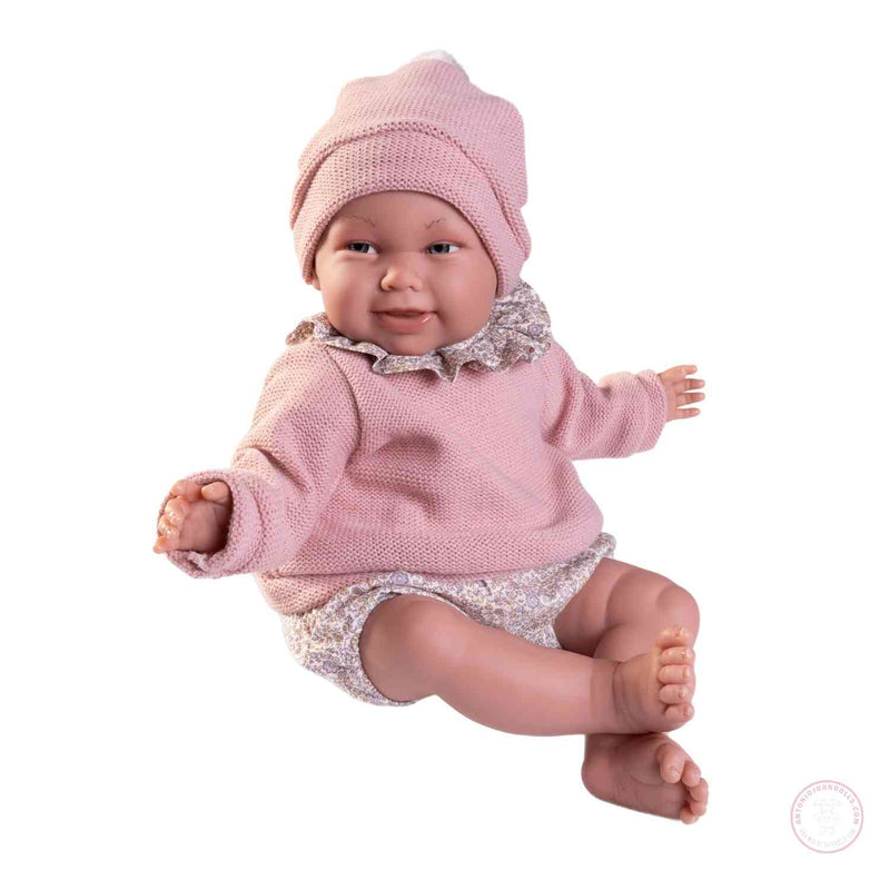 Muñeca realista 52 cm con ropa floral y gorro
