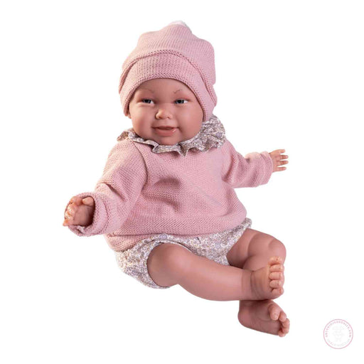 Muñeca realista 52 cm con ropa floral y gorro
