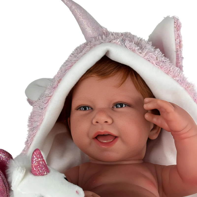 Muñecas Antonio Juan Recien Nacida Nica Pelirroja capa y peluche de unicornio (5000)