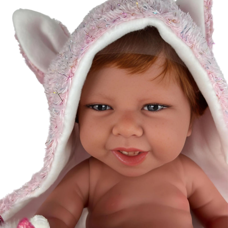 Muñecas Antonio Juan Recien Nacida Nica Pelirroja capa y peluche de unicornio (5000)