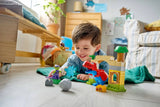 Niño jugando LEGO DUPLO 10463 Spidey-Rex dinosaurio rojo azul Duende Verde
