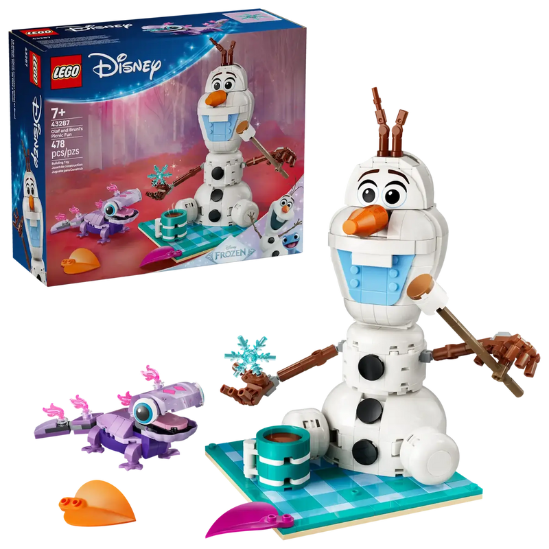 Olaf y Bruni LEGO sobre manta turquesa con taza chocolate y copo nieve
