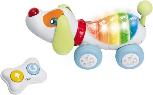 Perro radiocontrol parlante Chicco con piano musical interactivo de 5 botones, mando infrarrojo en forma de hueso y funciones educativas para enseñar números, palabras y notas musicales a niños pequeños
