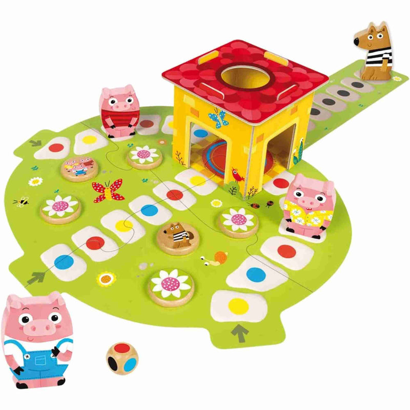 Piezas de madera del juego: cerditos, casas y lobo.
