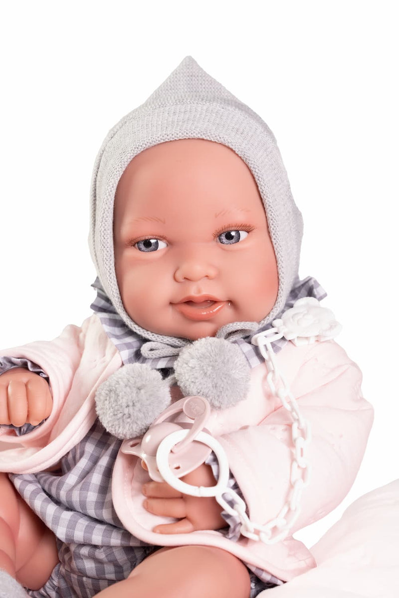 Recién Nacida de vinilo con cama acolchada
