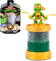 TX Sewer Conector Tortugas Ninja Treasure X con packaging original mostrando Michelangelo en tubería de alcantarillado dorada con líquido verde mutante

