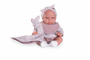 Muñeca bebé Tufi sentada con doudou y chupete
