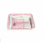 Vista superior cuna colecho Carlota mostrando estructura plegada y textiles
