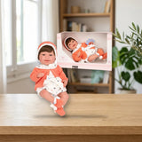 Arias Elegance 45 cm Adi Naranja con Sonajero (ARIAS-65308) sobre una mesa de madera