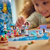 Niña jugando con las figuras del calendario LEGO Friends 42698
