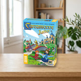 Devir Carcassonne Junior Trilingüe - Juego Cooperativo 4+ sobre una mesa de madera