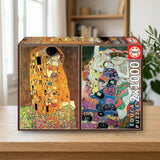 Educa Borrás Puzzle 2x1000 El beso + La virgen, Gustav Klimt (18488) sobre una mesa de madera