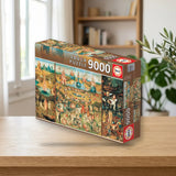 Educa Borrás Puzzle 9.000 El jardín de las delicias (14831) sobre una mesa de madera