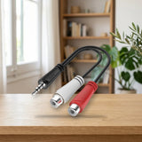 Hama Adaptador audio, conector macho jack de 3,5 mm, toma RCA, estéreo (200350) sobre una mesa de madera