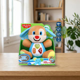 Juinsa Perro Peluche Musical Actividades (701184) sobre una mesa de madera