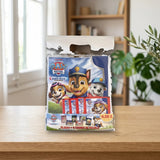 Pack Álbum + 4 Sobres Panini Paw Patrol 12 Search & Rescue sobre una mesa de madera