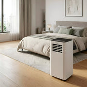 Aire acondicionado portátil Infiniton PACSF25A en un dormitorio luminoso