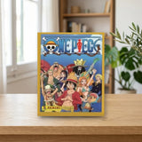Panini Sobre individual One Piece - El nuevo mundo (004382B5BIB) sobre una mesa de madera