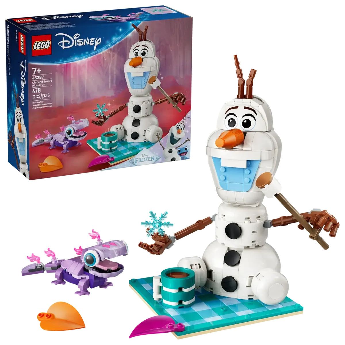 Olaf y Bruni LEGO sobre manta turquesa con taza chocolate y copo nieve
