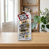 Spin Master Tech Deck Pack 4 Primitive (20136682) sobre una mesa de madera