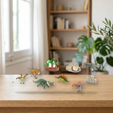 Toy Planet Conjunto 20 Dinosaurios Triásicos Ecoplanet (40791) sobre una mesa de madera