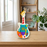 Guitarra Marchosa Infant Planet sobre una mesa de madera